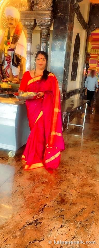 Kalpana with a temple offering