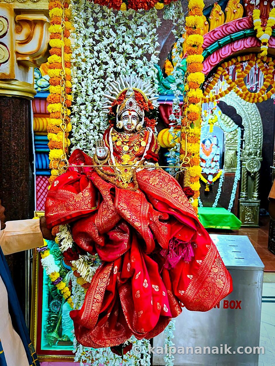 Goddess idol draped in red silk