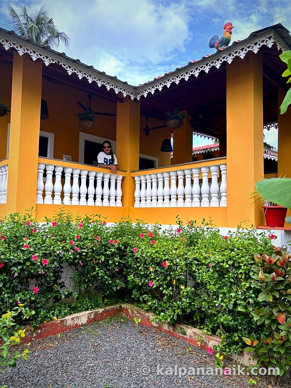 Yellow Goan house with white balustrade