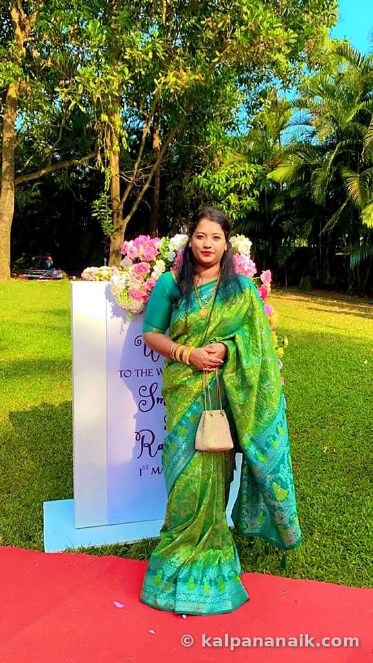 Kalpana in a green saree on a lawn