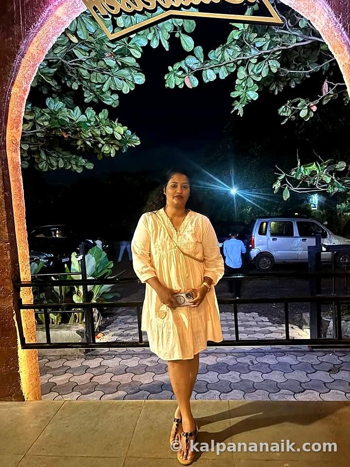 Kalpana in a cream outfit under the evening sky