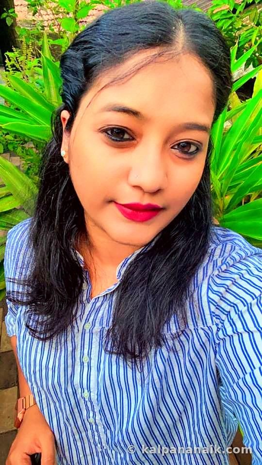 Selfie of Kalpana in a blue striped shirt