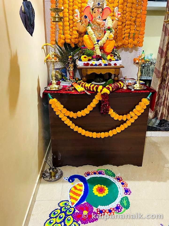 Decorated home shrine with rangoli