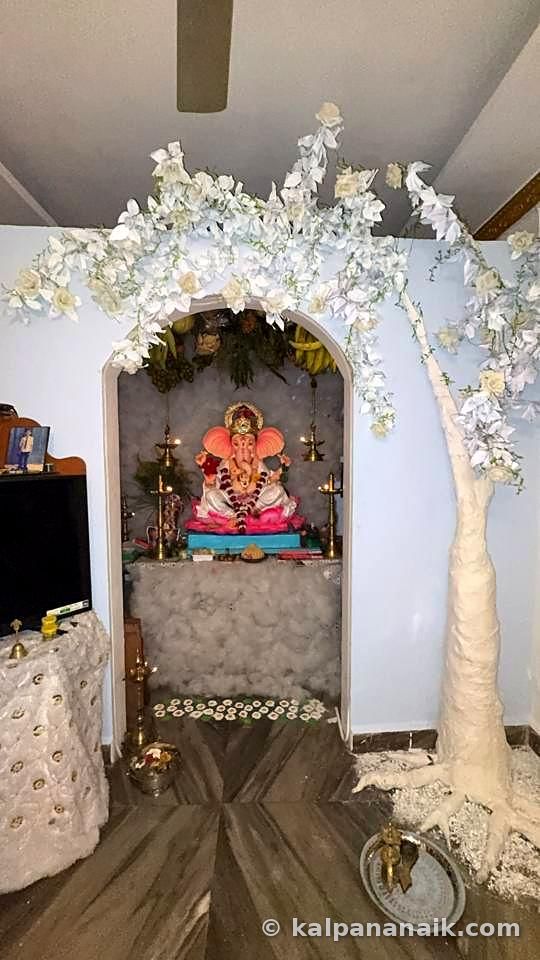 Ganesh shrine under a white tree
