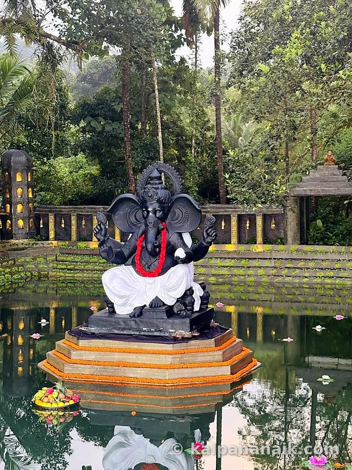 Stone Ganesh in a temple tank