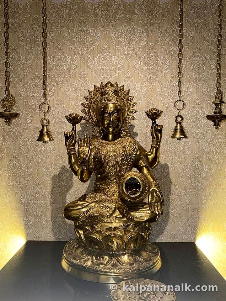 Brass goddess idol with bells