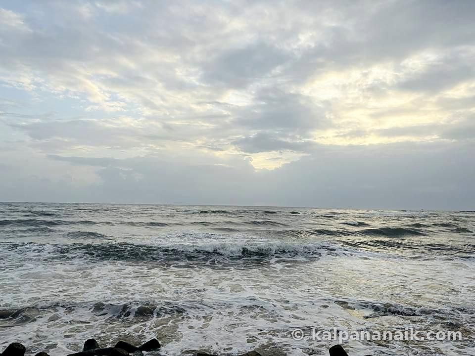Grey waves under heavy clouds