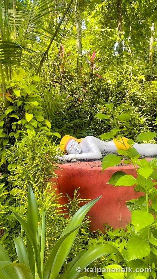 Garden statue among greenery