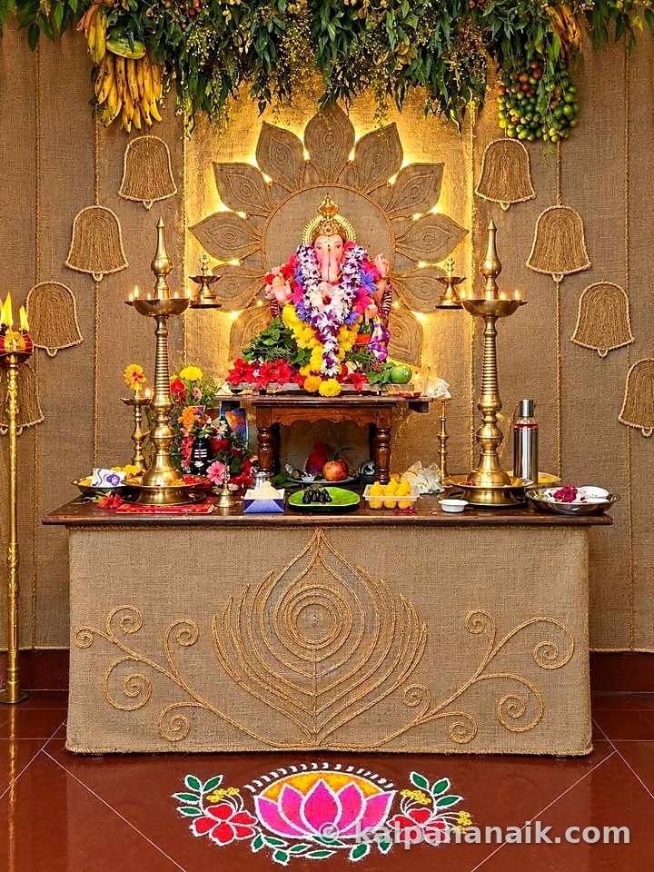 Ganpati altar with brass lamps