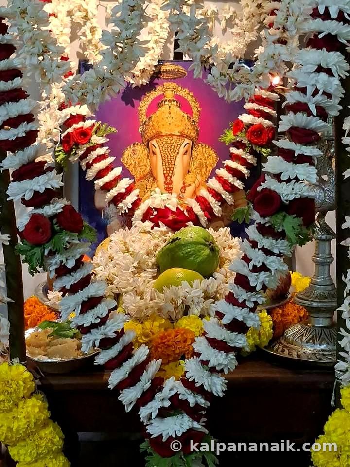 Ganesh idol framed in garlands