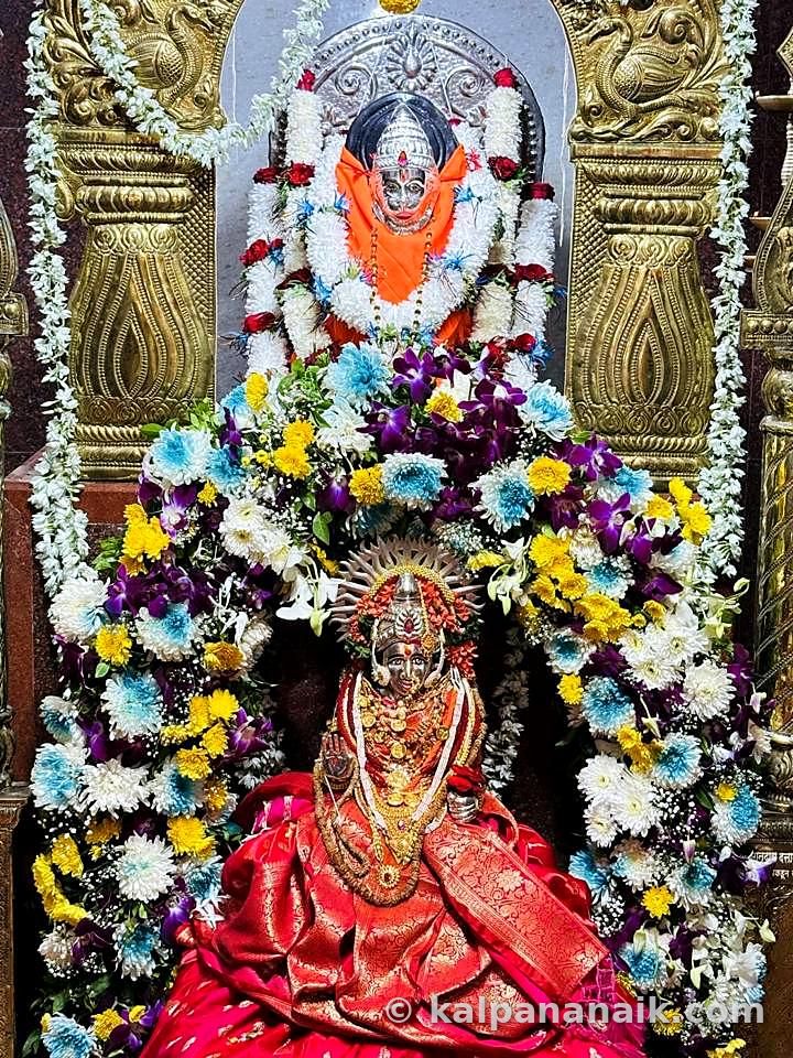 Deity shrine covered in flowers